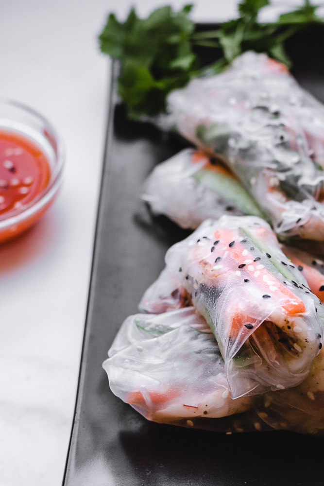 Shrimp Spring Rolls with dipping sauce on platter