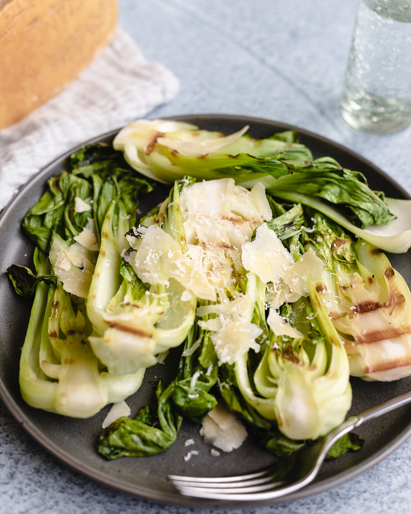Grilled bok choy caeser salad on plate
